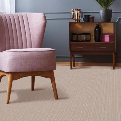 textured beige carpets in a stylish living room with pink accent chair